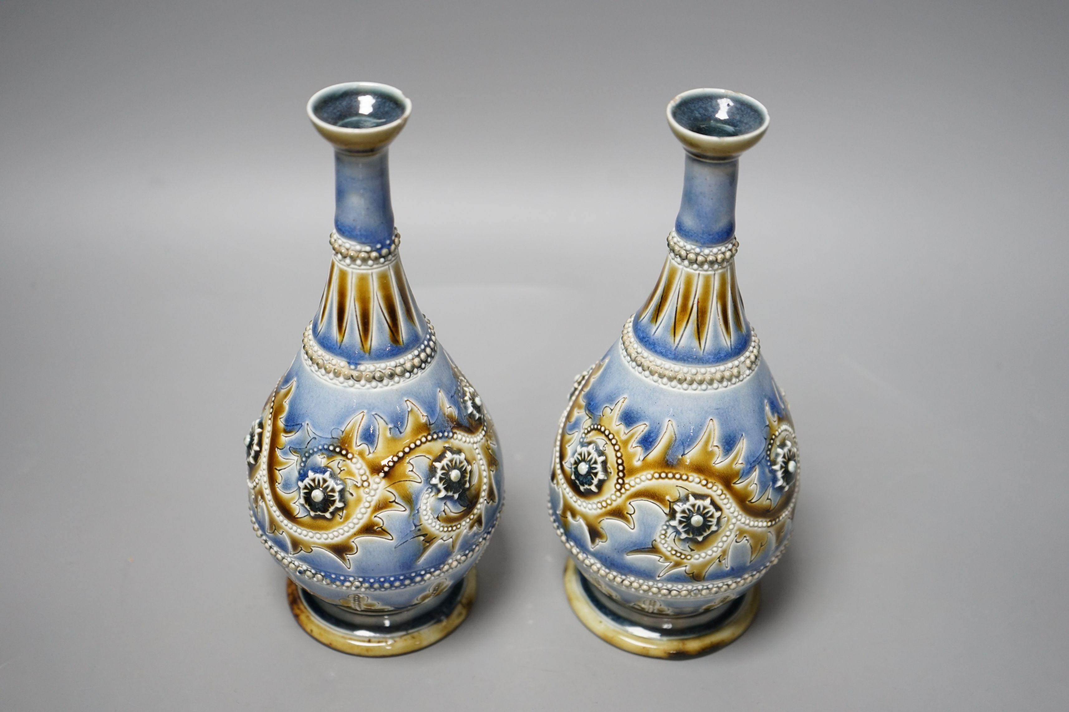 George Tinworth, a pair of Doulton Lambeth vases, stamped 1876, 20cm high